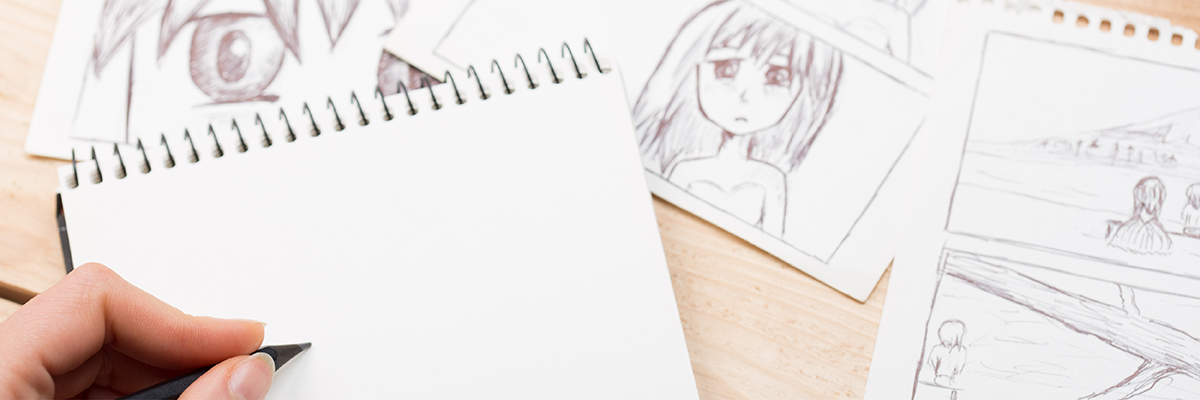 Eine Person zeichnet einen Comic mit Bleistift für eine Hochzeitszeitung