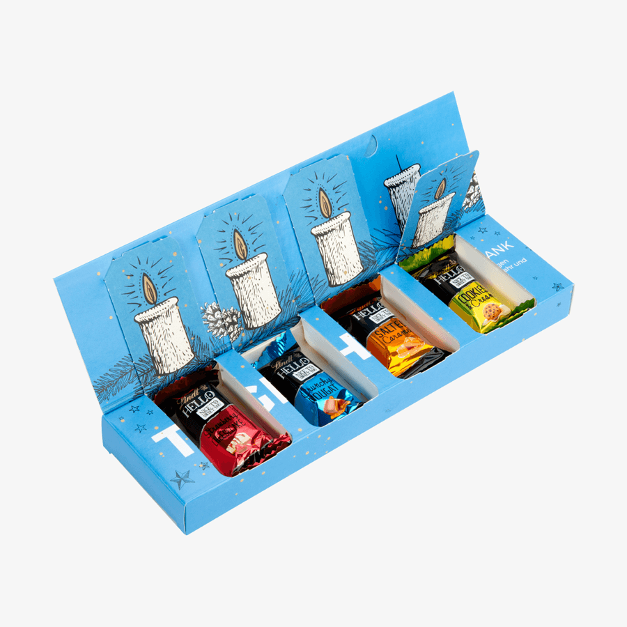 Blauer, bedruckter Lindt-Adventskalender als Adventsbox geöffnet: darin vier HELLO-Mini-Sticks