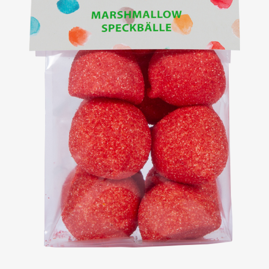 Detailansicht rote Marshmallow-Speckbälle im transparenten Folienbeutel