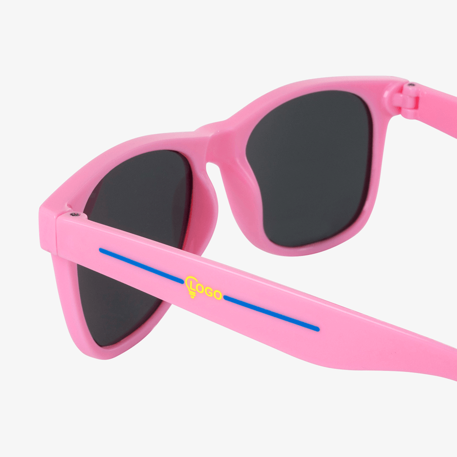 Pinke Kunststoff-Sonnenbrille mit zweifarbigem Tampondruck auf einem Bügel